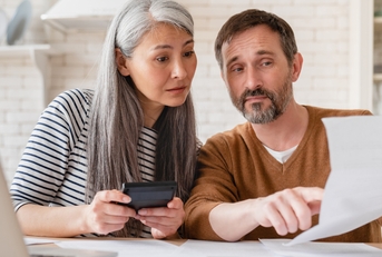wife and husband family doing paperwork