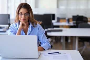 employee worker looking at laptop at workplace