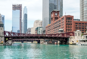 Chicago river with bridge and buildings in background
