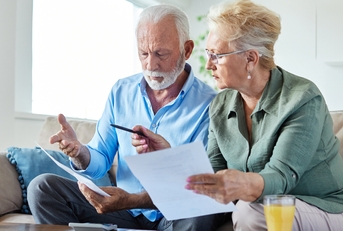 senior couple calculating their bills