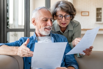 senior couple reading documents