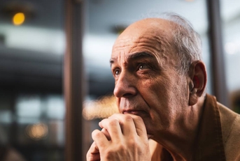 Close up portrait of pensive and worried senior man