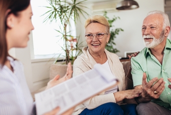 couple consulting with insurance agent
