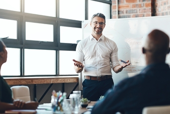 ceo and whiteboard with presentation for business people