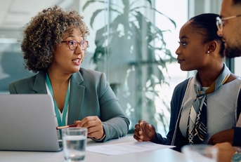 Financial advisor talking to young couple