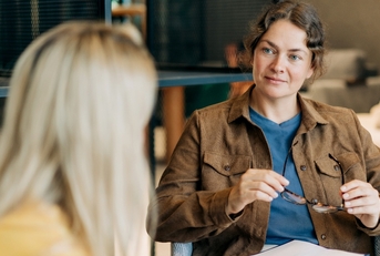 Mental health counselor speaking to patient