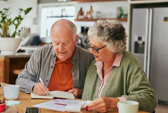 senior couple managing home finances 