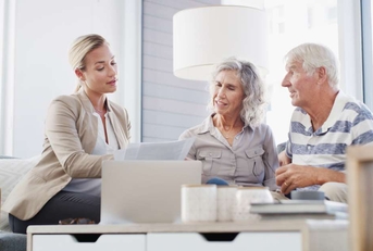 senior couple discussing retirement plan with financial advisor