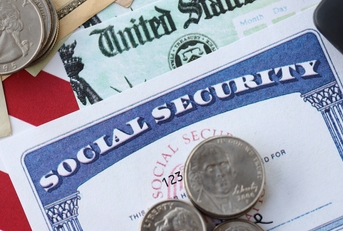 social security number card and calculator on American flag