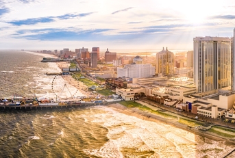 Atlantic City, New Jersey, as seen from aerial view featuring boardwalk and buildings