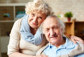 Affectionate elderly couple hugging