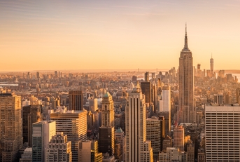 View of New York City skyline from high up at sunset