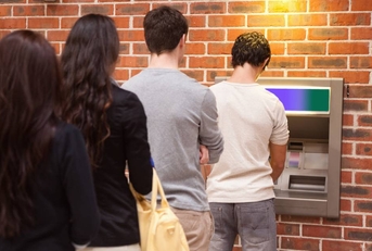 People in line to withdraw cash from ATM