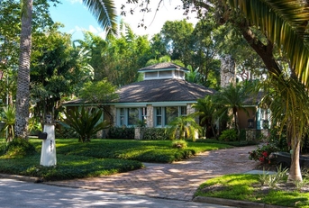 exterior of home with tropical landscaping