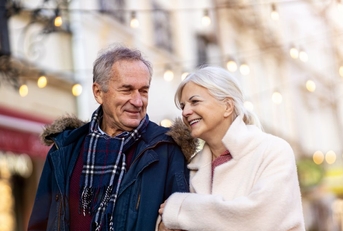 older couple walking outdoors during winter