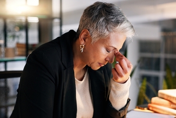 An older woman frustrated