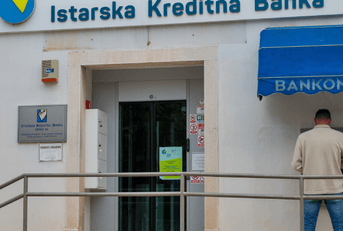 person withdrawing money from atm in croatia