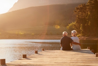 retireed couple sitting on dock