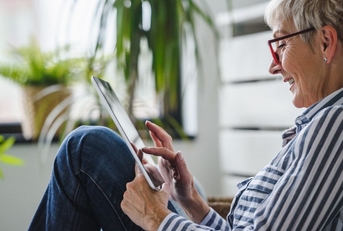 older woman on tablet