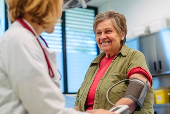 Senior patient with doctor