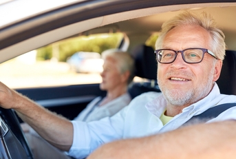 happy senior couple driving in car 