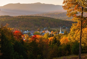 Overlooking a peaceful town in autumn at sunset