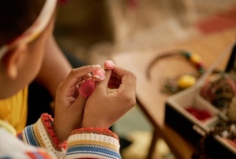 Girl looking at jewelry box