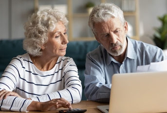 retired couple doing taxes