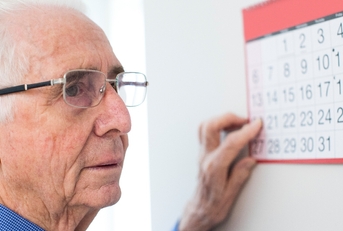 Senior looking at calendar