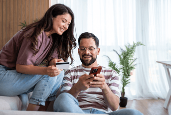 Couple using credit card online