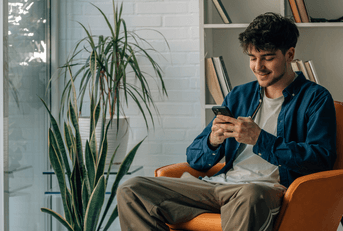 Man on cellphone at home