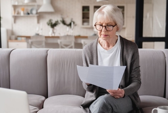 senior woman reviewing paperwork