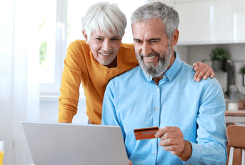 Couple using credit card online