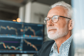 Older man looking at stock market