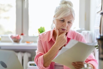 senior woman reviewing papers
