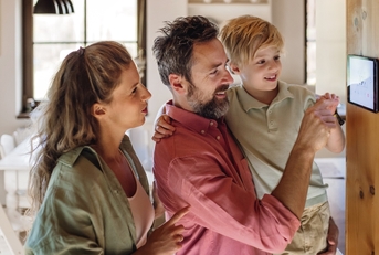 Family using energy efficient home device