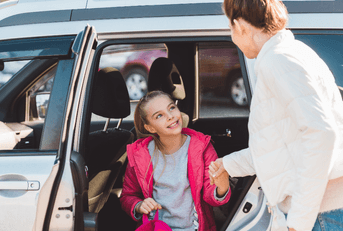 Mom and daughter getting out of car