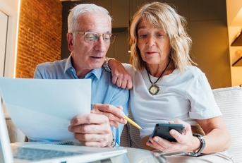 Older couple looking at their finances