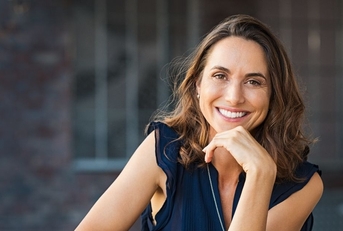 Smiling mature woman in a blue top