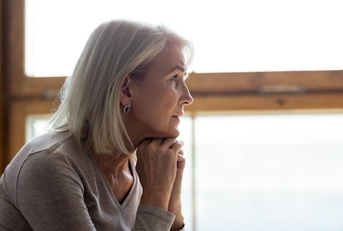 Pensive looking mature woman