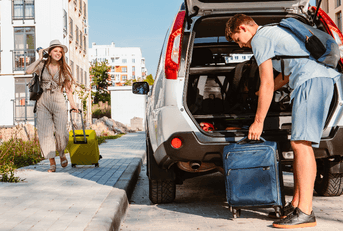 Young couple packing car 