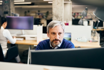 Man working on a computer at the office 