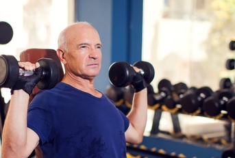 Senior man working out in gym
