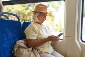 Senior woman riding the bus