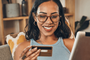 Woman on tablet with credit card
