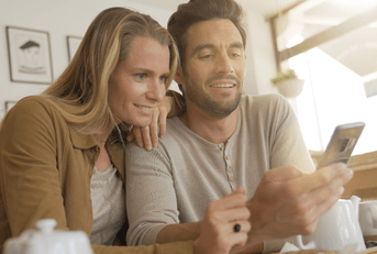 Couple on cell phone in coffee shop