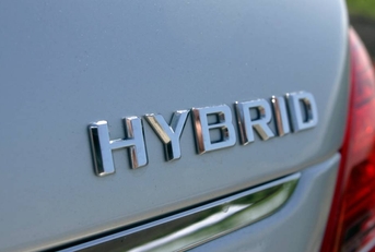 Trunk of car says hybrid