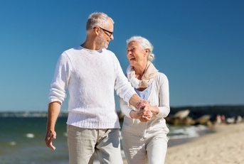 Older couple happy at the beach