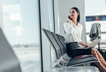 traveler on phone and laptop