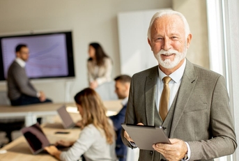 Older business man in a conference room